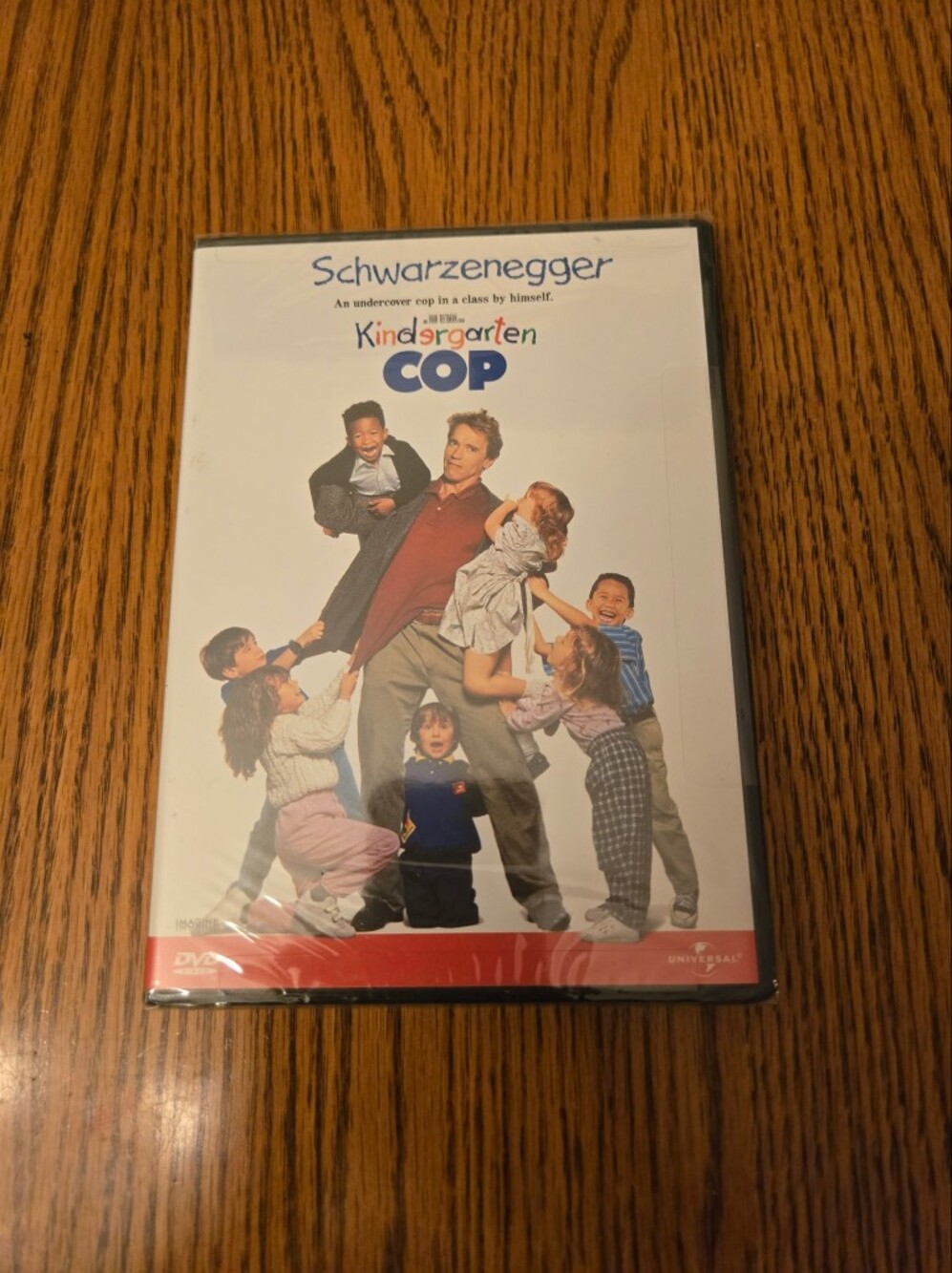 Universal Kindergarten Cop DVD with White and Red Artwork